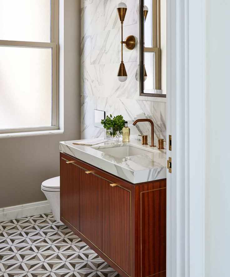 bathroom with geometric mosaic floor tiles