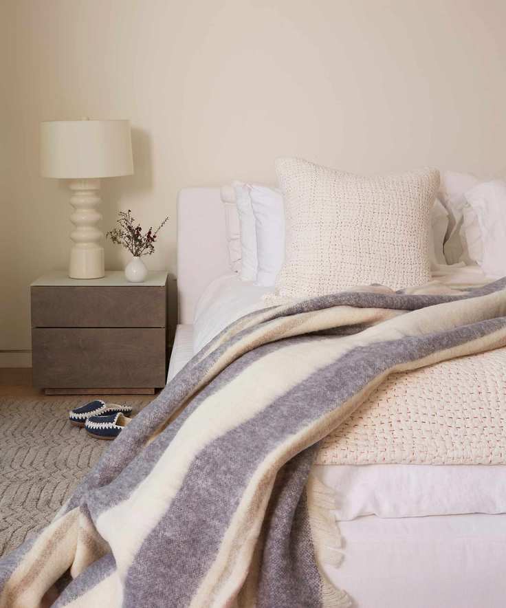 Scandinavian bedroom with cream walls and texture
