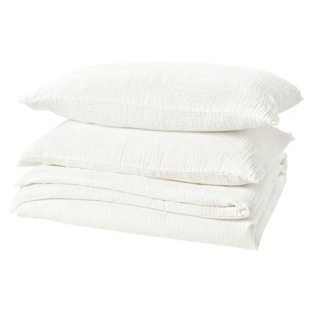 White IKEA Shersmin Bedding on a folded duvet with two pillows stacked on top.
