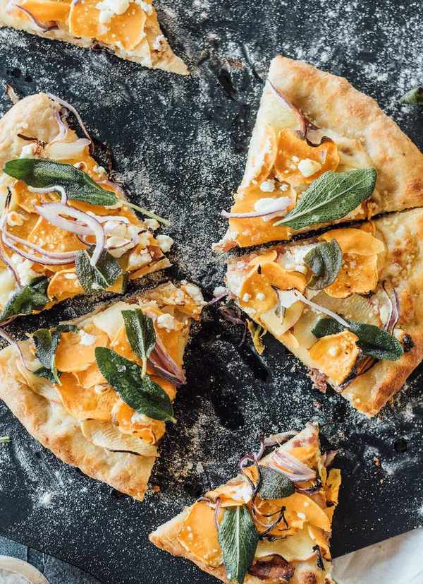 homemade fall pizza with sweet potatoes, apple, bacon and fried sage
