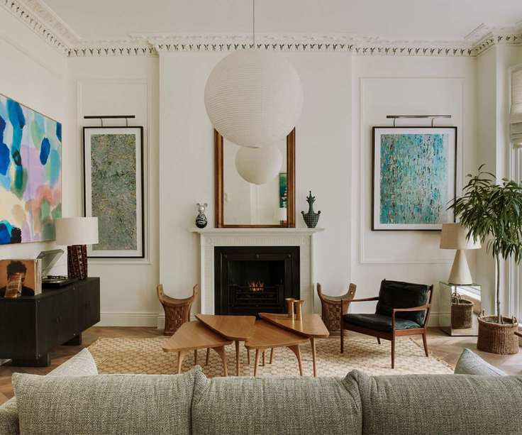 Transitional living room with prints