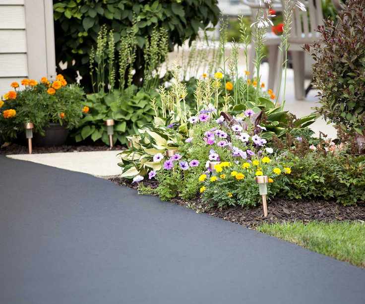 Driveway with flowers and solar lights