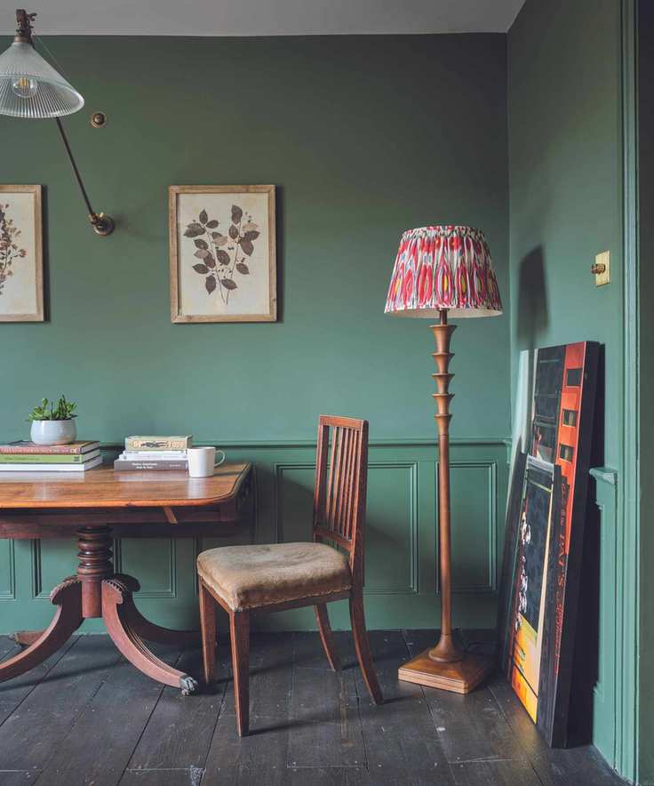 green dining room with vintage furniture