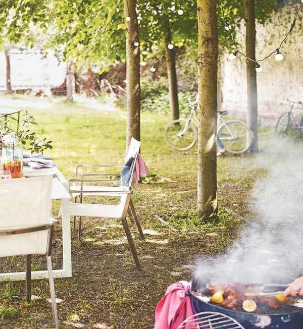 grassy area with table and barbecue