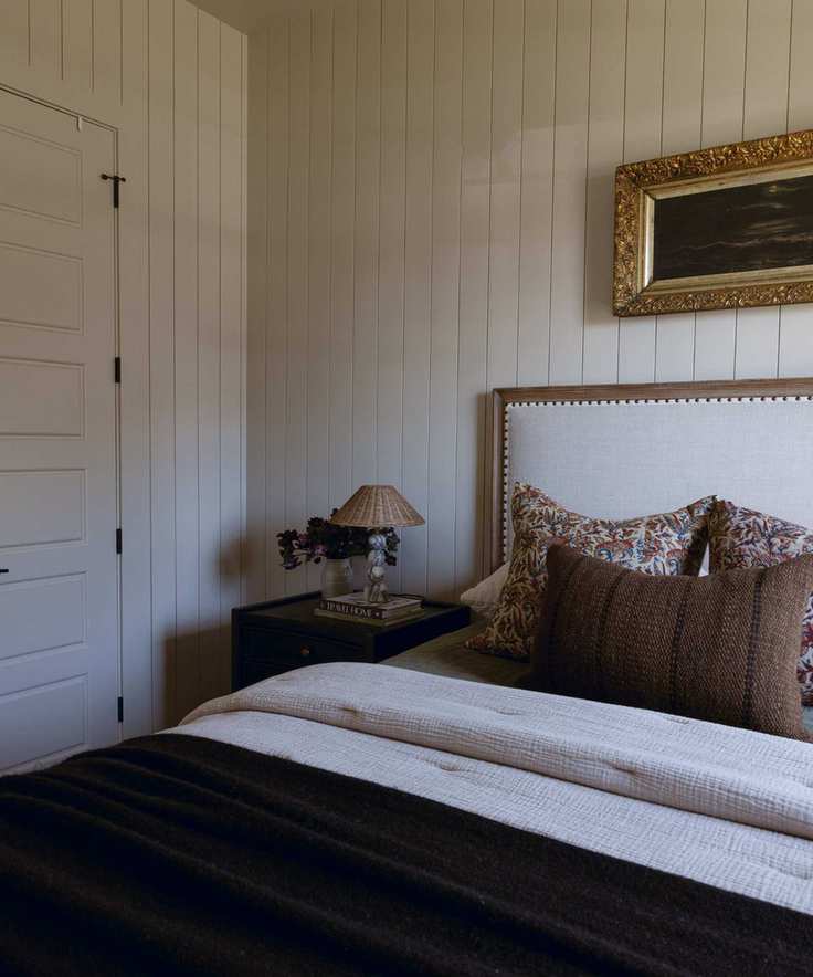 A bedroom with Accessible Beige walls and coordinating furnishings.