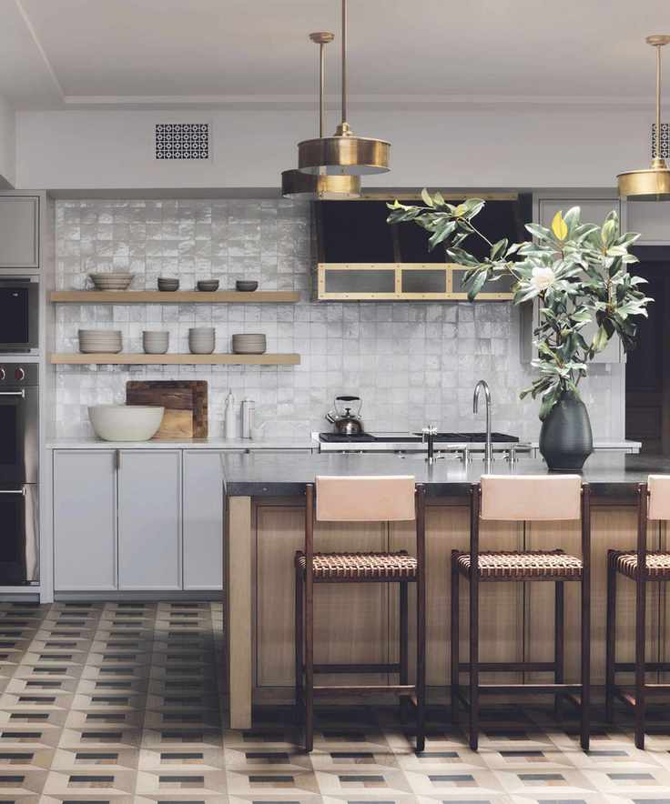Kitchen featuring an island and patterned tiles