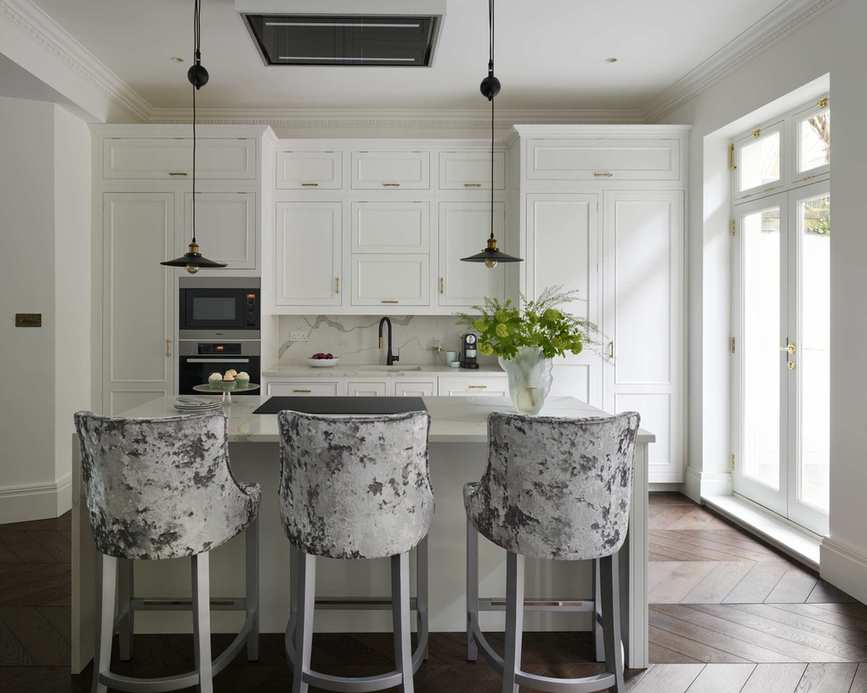 Small white kitchen ideas with white cupboards and an island with grey velvet bar stools