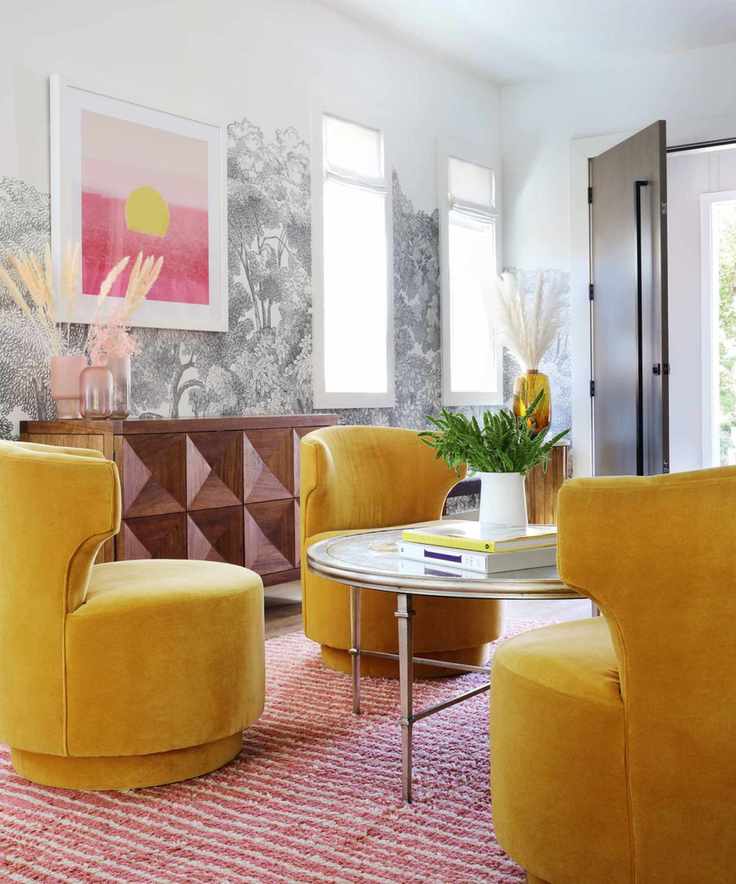 Entryway seating area with yellow velvet chairs