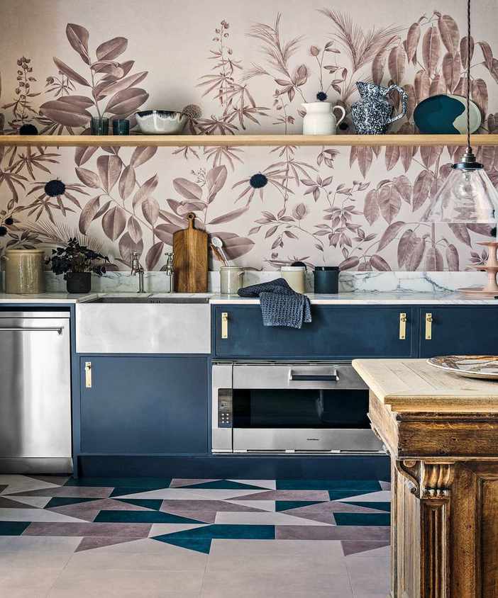 kitchen with botanical wallpaper, marble countertops and purple cupboards