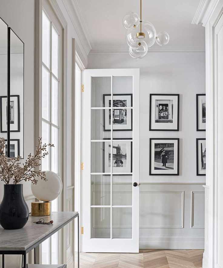 white hallway with black and white photography