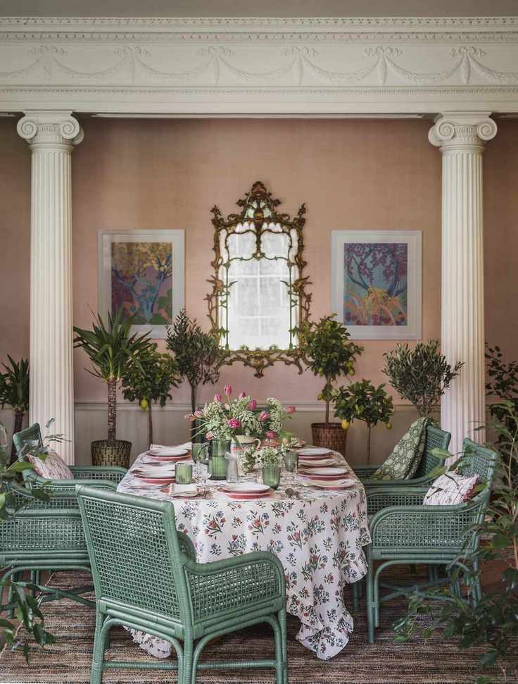 green wicker chairs in classical designed pink dining room