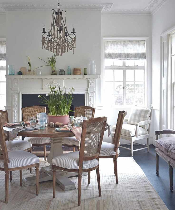 Dining room with fireplace and beaded chandelier