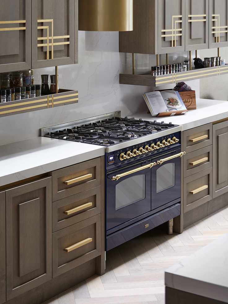 kitchen with brass detailing and drop-down shelving for spices