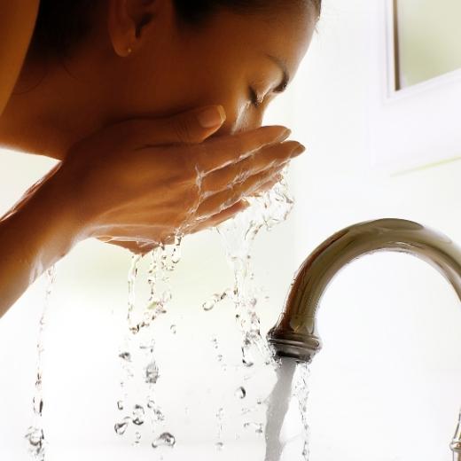 Woman washing face