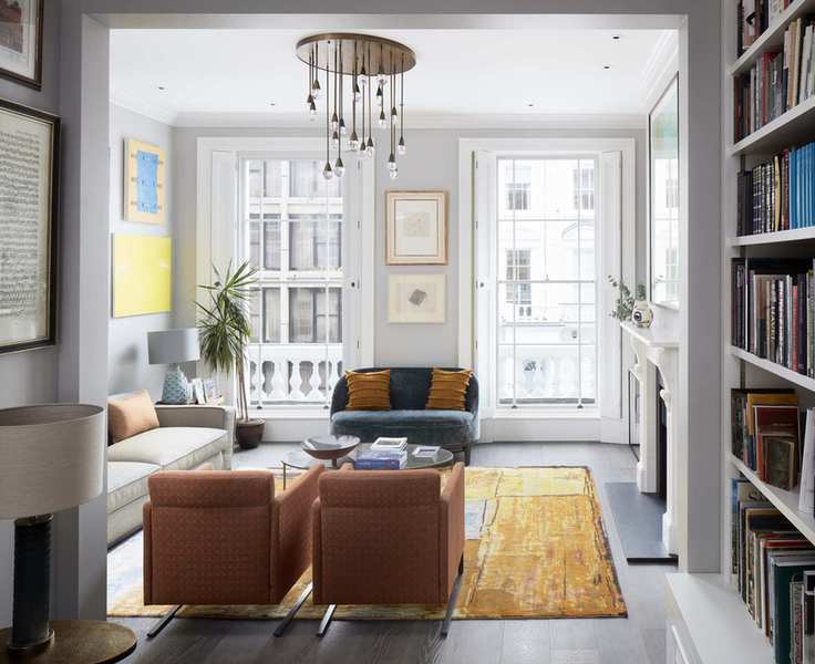 Teardrop brass chandelier and colorful furniture