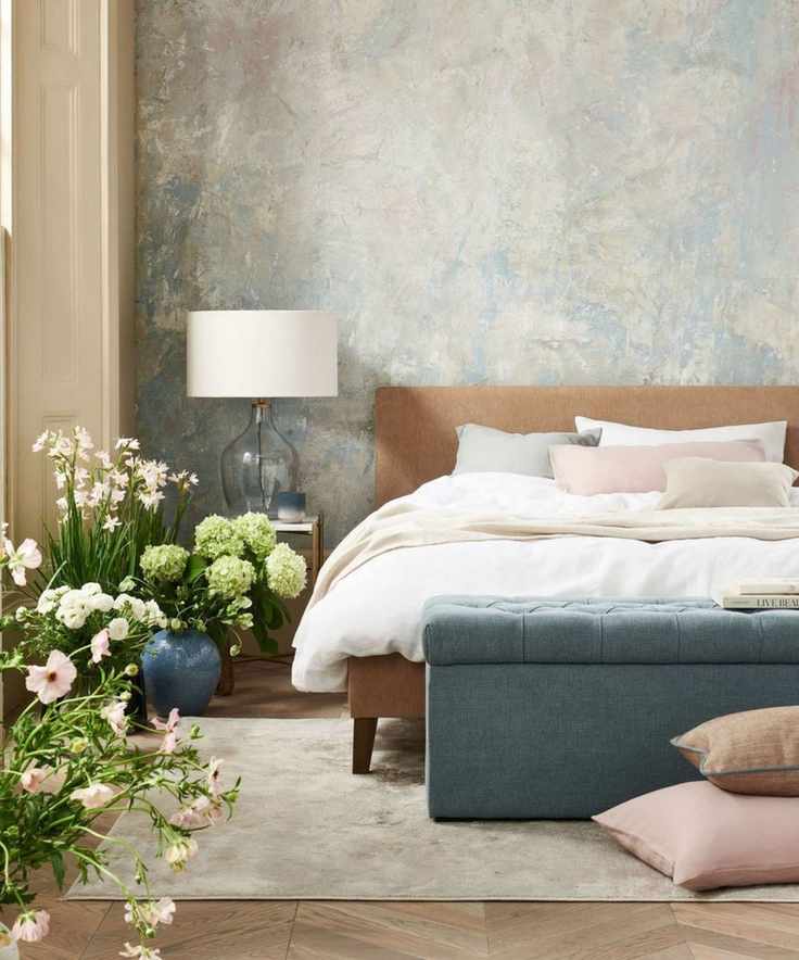 Blue storage ottoman, wooden headboard