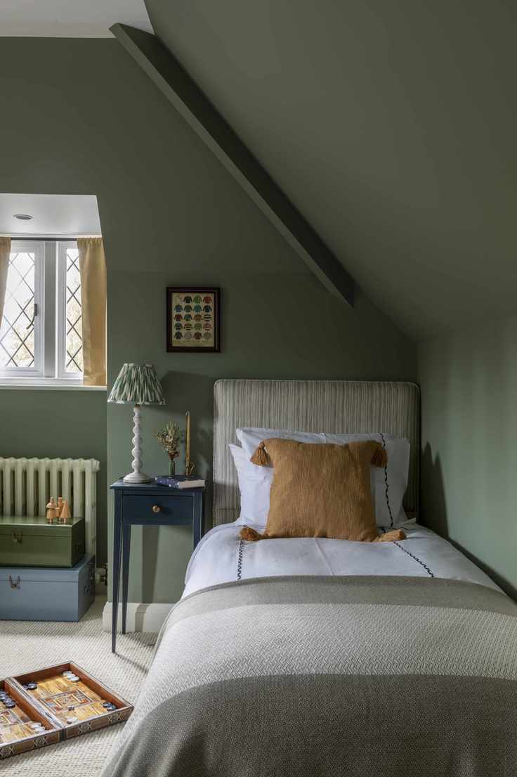 Green children's bedroom with cozy decor