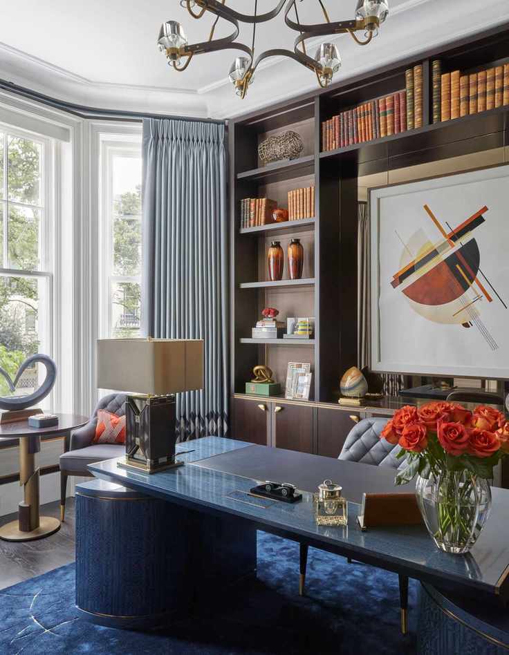 Blue polished stone desk with dark blue carpet and gold accents