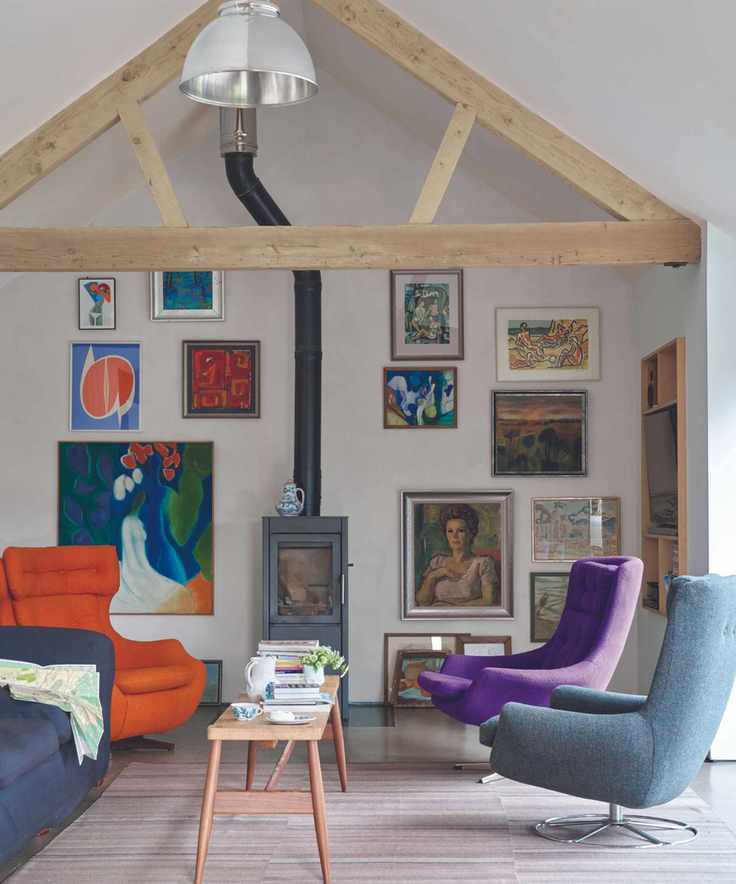 White living room with modern furniture and gallery wall
