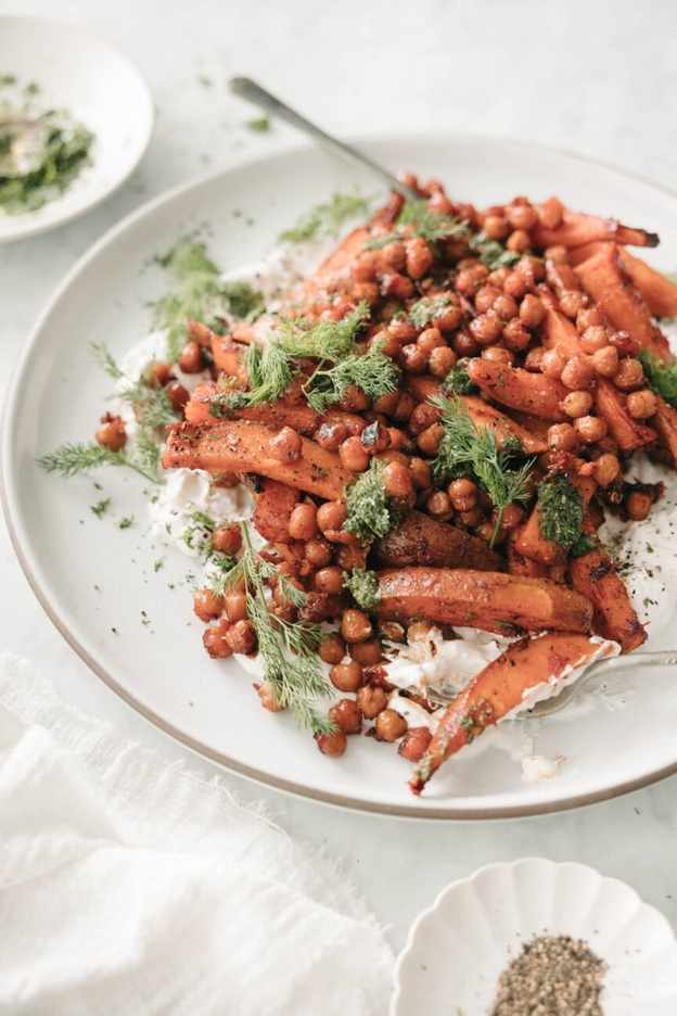 sweet potato chickpea bowl with feta yogurt and herbs