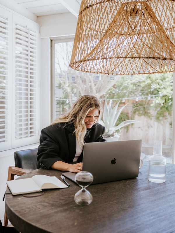 Woman practicing writing rituals at her desk.