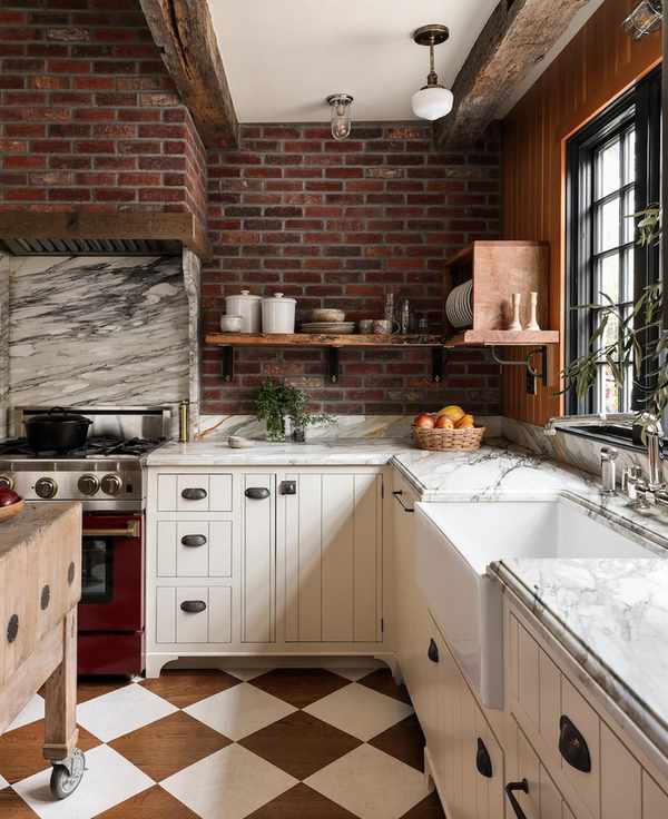 A close-up of a San Francisco kitchen's marble counters and exposed brick walls.
