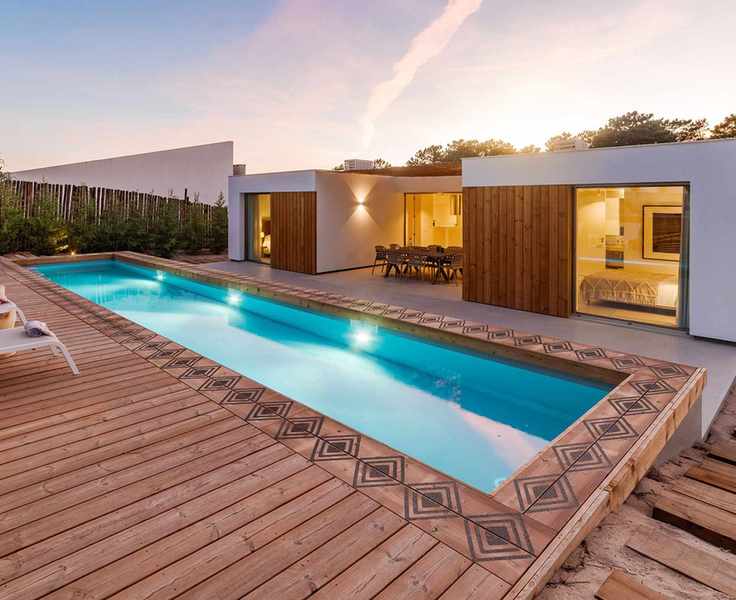 decking with patterned border around pool