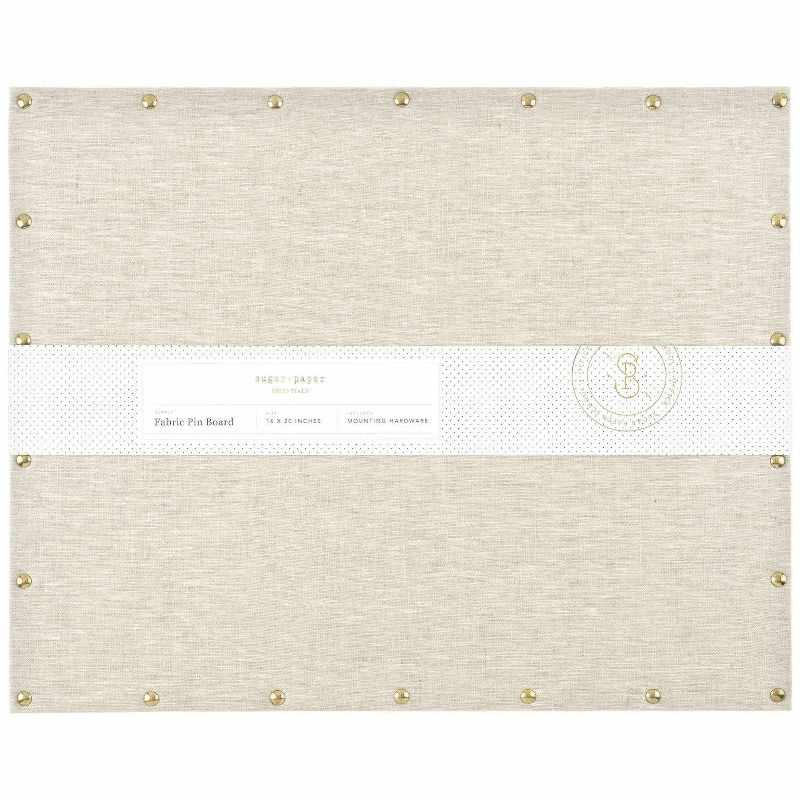 A cream fabric covered rectangular pin board.