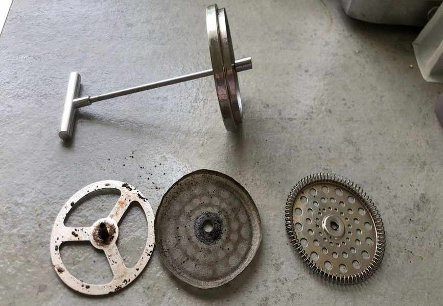 French press taken apart before cleaning