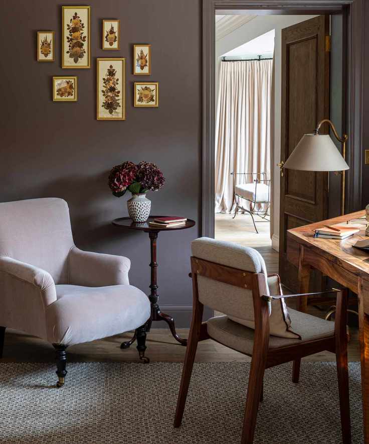 home office with brown walls and furniture