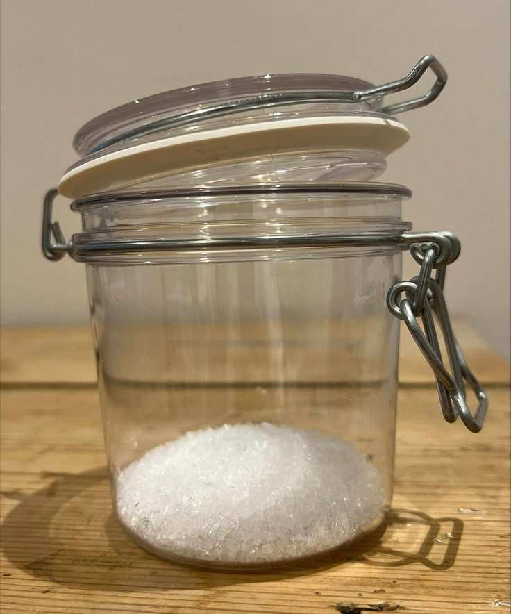 A mason jar of epson salts with essential oil added from home smelling salt fragrancing
