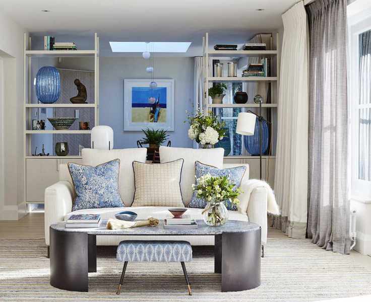 A living room curtain idea with two layers of white and grey sheer curtains