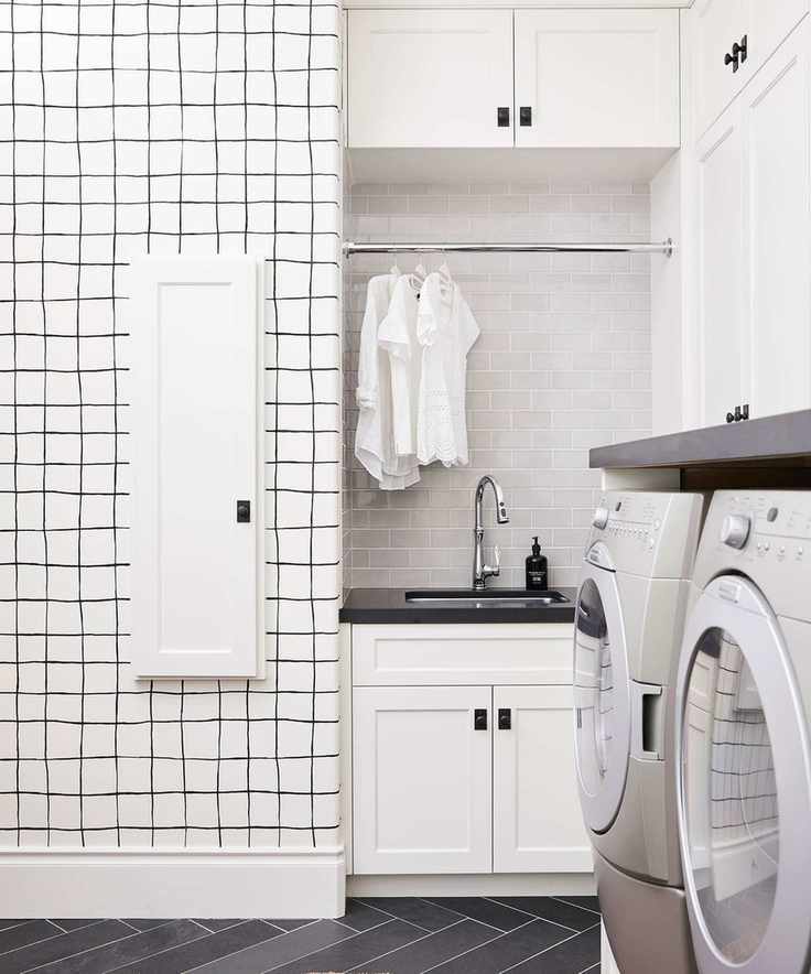 Laundry room with appliances and overhead storage