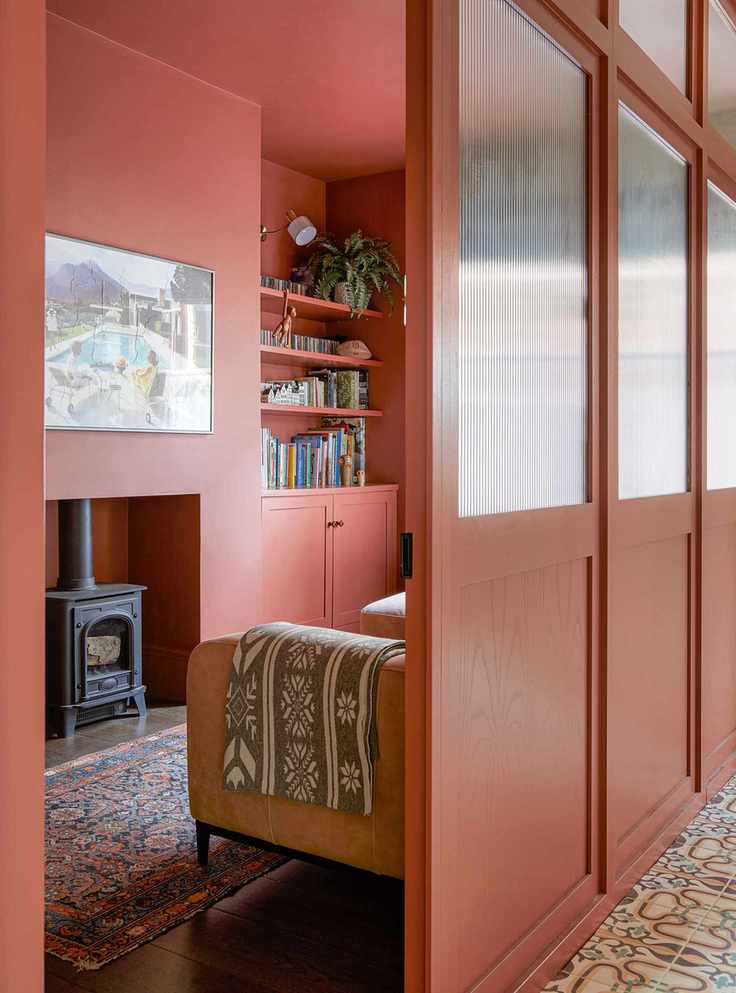 Red living room with red ceiling and room divider
