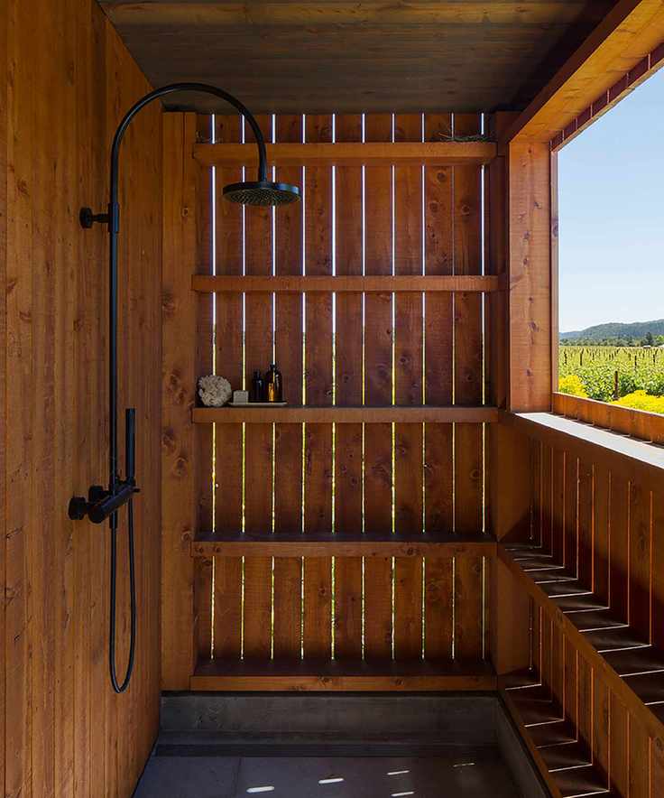 Outdoor shower in wooden enclosure