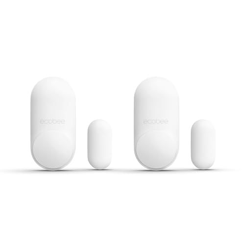 Two pairs of white oval door sensors