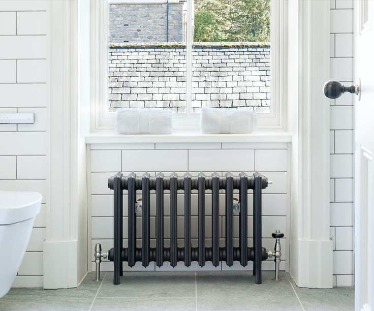 Spartan column radiator in white bathroom