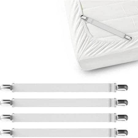 Four white elastic sheet straps for bed sheets