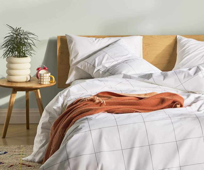 Luxe Core Sheet Set on a bed.
