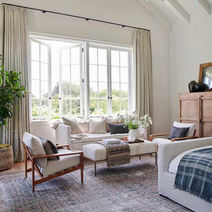 Country-style bedroom with seating area