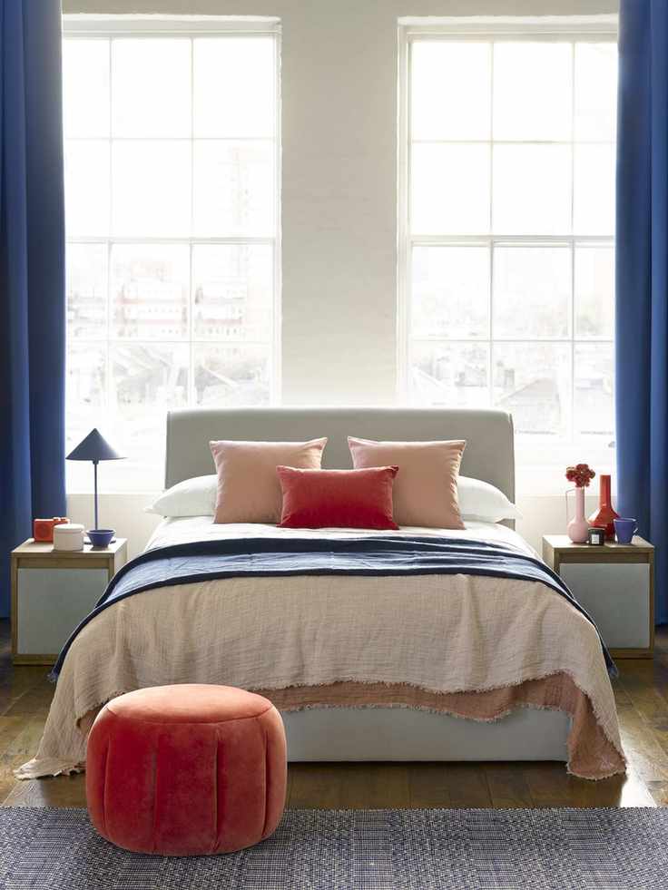 Bedroom with nightstands and ottoman bed