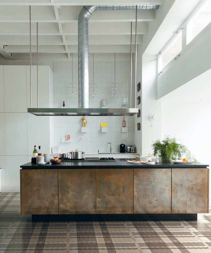 Large stainless steel extractor hood in modern kitchen