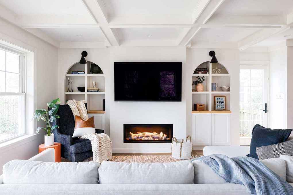 Bright living room featuring alcove shelving