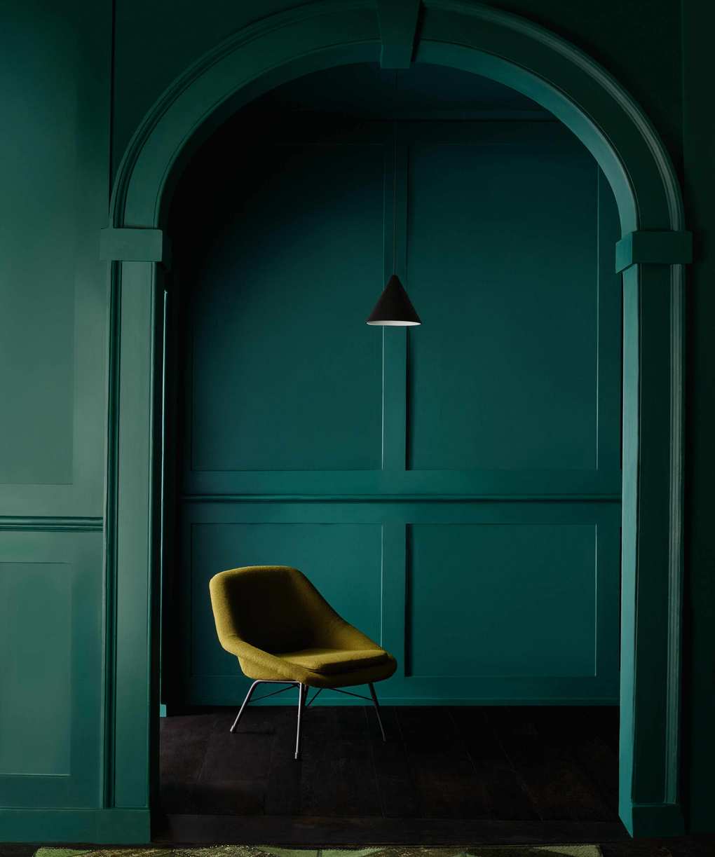 panelled room with alcove painted in dark green