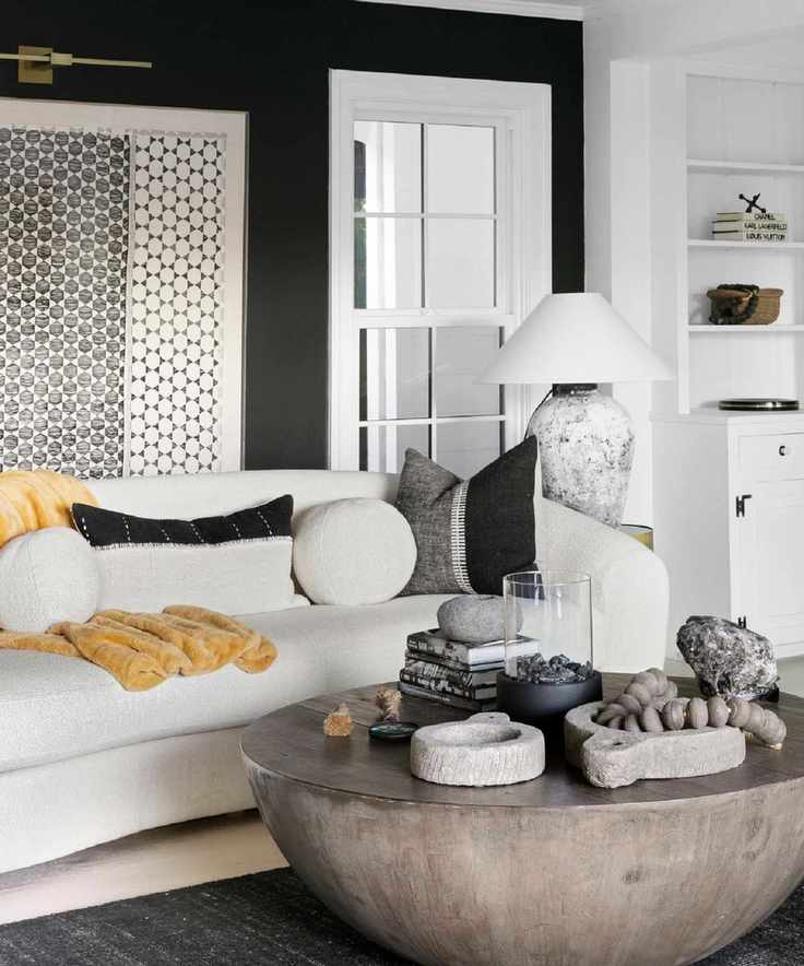 Neutral living room with bouclé sofa and yellow fur throw