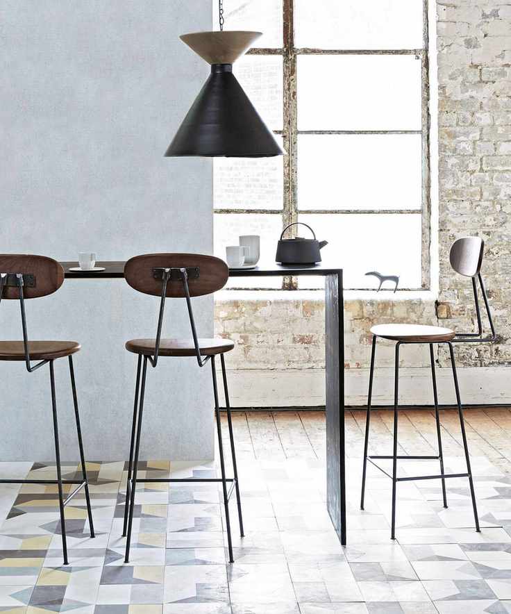 Small dining room with narrow table and bar stools