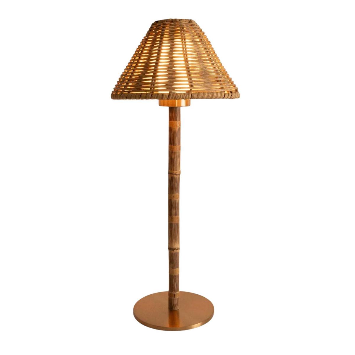 a portable lamp with a rattan shade