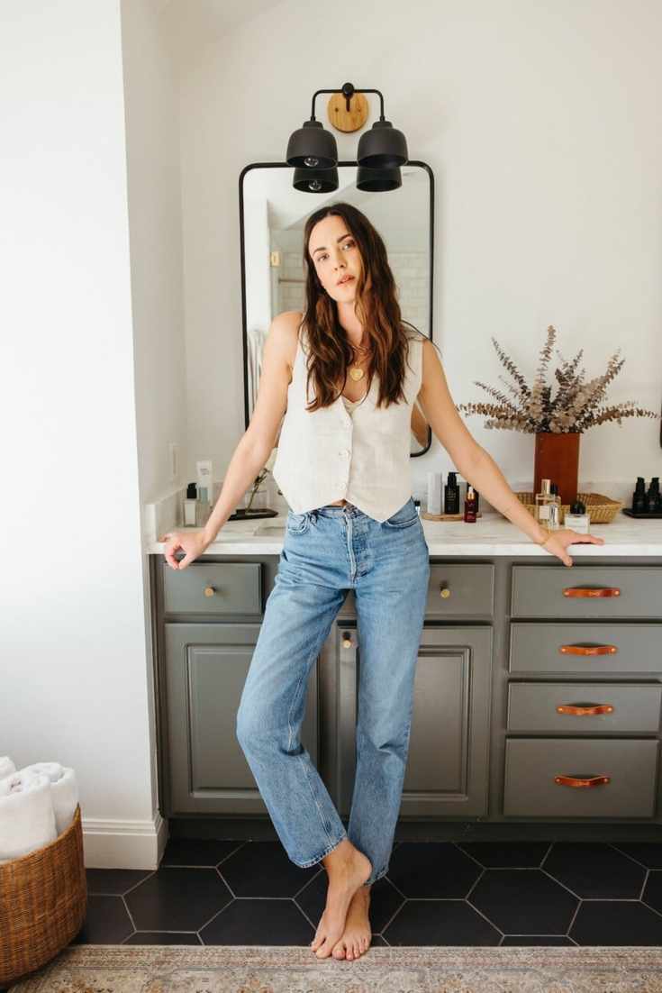 woman in bathroom wearing jeans
