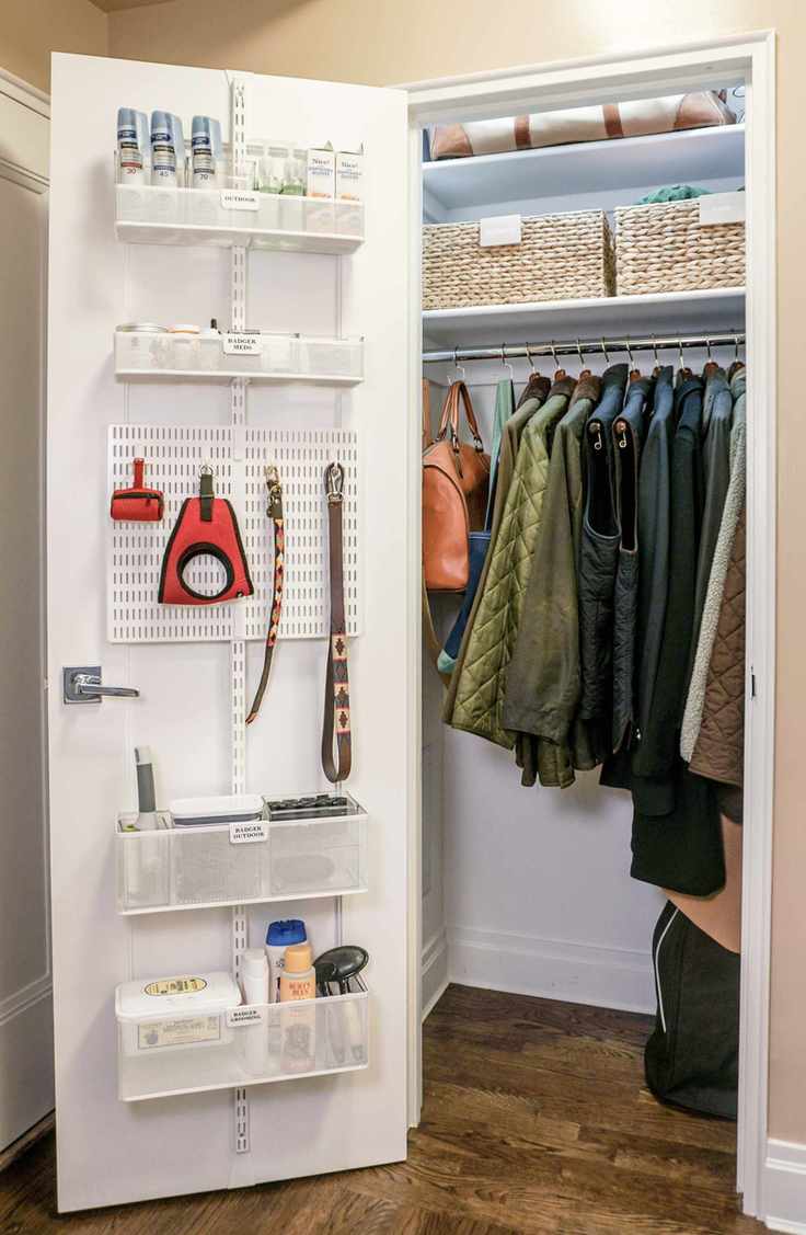 hallway closet with open door and behind door and interior storage