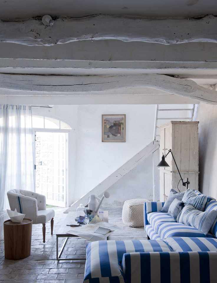 Coastal living room with striped sofa